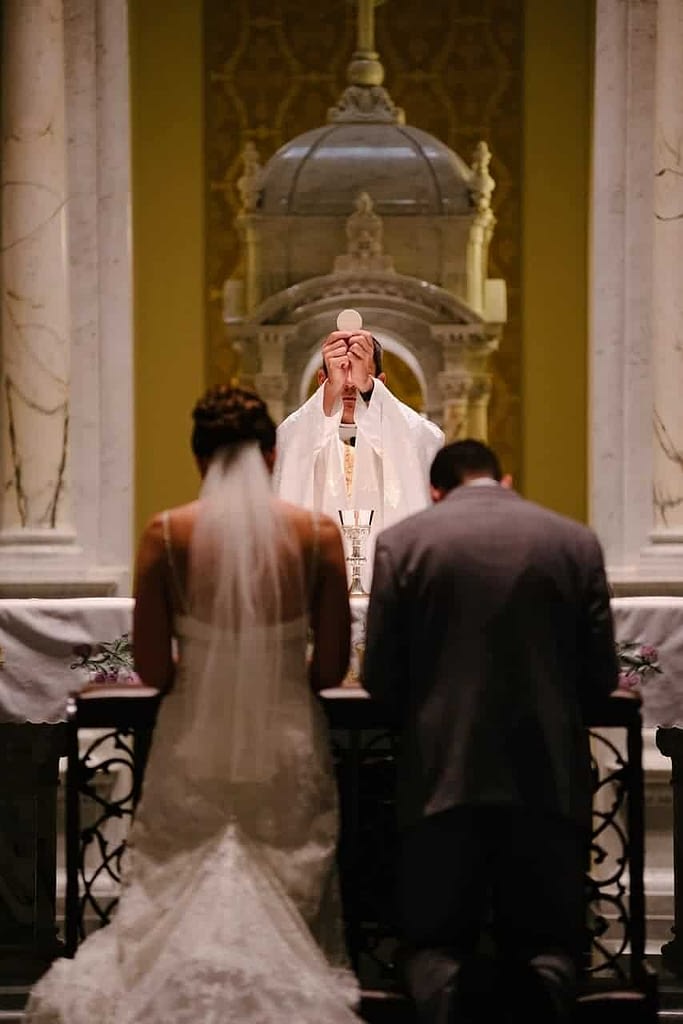 catholic wedding mass with bride groom and celebrant